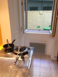 Studio centre avec terrasse