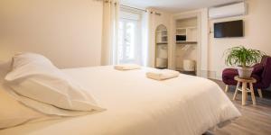 Appartements Les Arenes - 2 chambres - Climatise avec Balcon : photos des chambres
