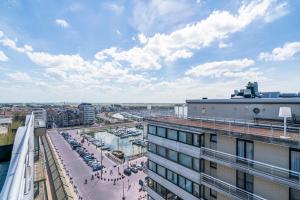 Duplex met zonnig zuidterras aan haven en zee