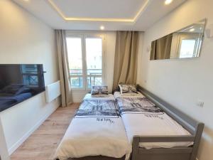 Appartements Studio T1 Cosy proche Paris et Stade de France : photos des chambres