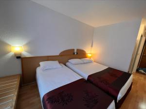 Hotels Kyriad Direct Arpajon : photos des chambres