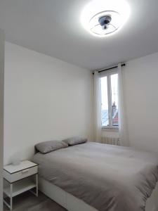 Appartements La vie en blanc et noir Maisons-Laffitte : photos des chambres