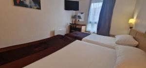 Hotels Kyriad Direct Arpajon : photos des chambres