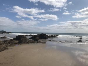 Corn Barn at East Trenean Farm -Luxury Cornish Barn Conversion sleeping 8 with hot tub, private garden, rural views and EV facilities