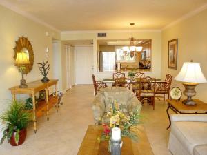 Tranquil waterfront condo with pool and steps to beach