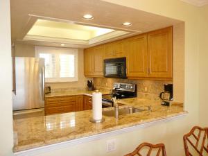 Tranquil waterfront condo with pool and steps to beach