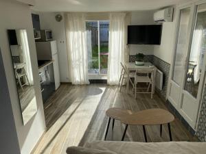 Appartements Charmant studio avec jardin : photos des chambres