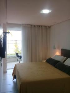 Flat com varanda beira-mar, apt 102
