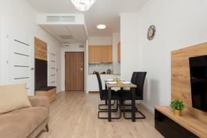 Central Business District Warsaw Apartments by Noclegi Renters