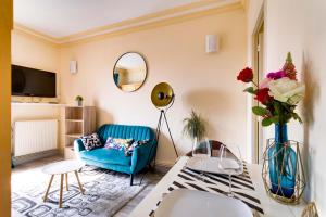 Appartements Au PIED de la GARE aux PORTES de PARIS : photos des chambres