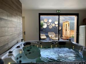 Appartements •Le Cosy• Appart Spa & Sauna by Spaona • : photos des chambres