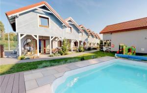 Stunning Home In Karwia With Outdoor Swimming Pool, Heated Swimming Pool And 2 Bedrooms