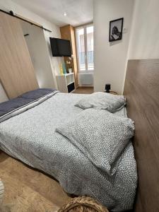 Appartements Au coeur du village : photos des chambres