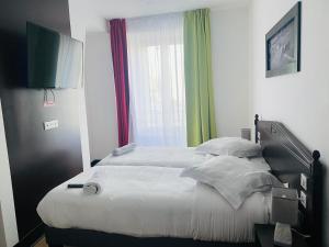 Enzo Hotels Limoges Centre Jourdan by Kyriad Direct : photos des chambres