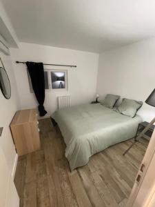 Appartements Logement Cosy a 20 minutes de Paris : photos des chambres