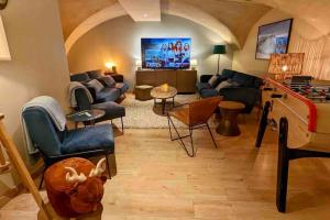 Appartements L'Aiguille avec jacuzzi et sauna : photos des chambres