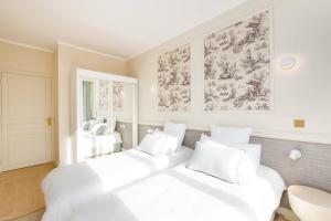 Appartements Appartement luxueux vue mer a Deauville avec services : photos des chambres