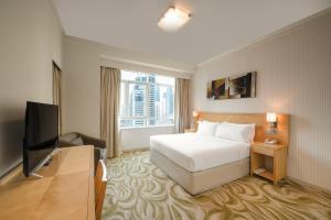 Deluxe One-Bedroom Lakeview Suite room in Oaks Liwa Heights Hotel Suites