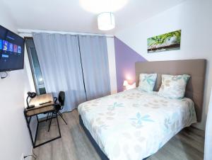 Appartements Beau-Jean, Un Cocon Sympa 5 min a Pied du Centre-Ville, Parking Prive, a 10 min du CHU : photos des chambres