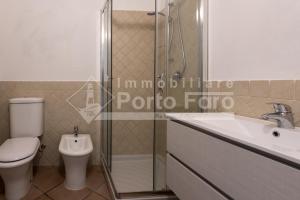 L324 - Bilocale con giardino e vista mare panoramica a Porto Mannu