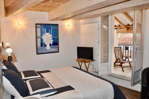 Appartements les Chambres Tropeziennes : photos des chambres