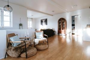 Ocean Views and Gorgeous Design in a Light-Filled 3 BDRM1.5 Bath Village Home