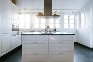 Ocean Views and Gorgeous Design in a Light-Filled 3 BDRM1.5 Bath Village Home