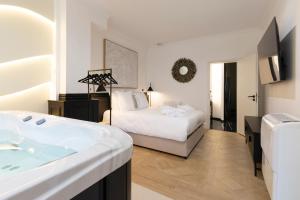 Appartements Le Reve de Stanislas - Jacuzzi : photos des chambres