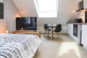 Appartements L'atticisme : Jacuzzi & Parking : photos des chambres