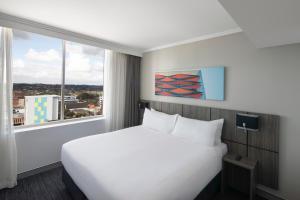 Deluxe Queen Room room in Travelodge Hotel Bankstown Sydney