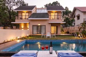 StayVistas Enchanting Haven - Modern Interiors, Sprawling Lawn with Gazebo, Swimming Pool, Indoor Games