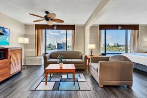 Suite -1 King Bed/Pullout Sofa Bed room in Best Western Orlando Gateway Hotel