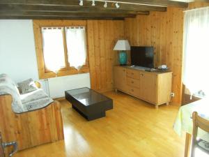 Appartements appartement style chalet avec sauna et terrasse : photos des chambres