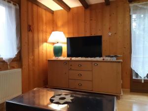 Appartements appartement style chalet avec sauna et terrasse : photos des chambres