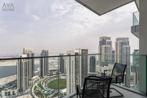 Elegant Luxury Apartment with Stunning Lake Views in Dubai Creek Harbour By ĀYA Boutique