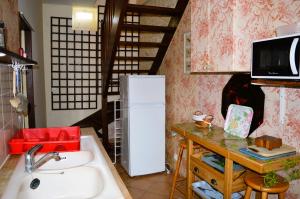 Maisons de vacances La Quinta, belle maison en pierres avec jardins : photos des chambres