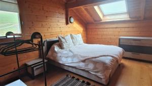 Chalets Ravissant chalet en madrier : photos des chambres