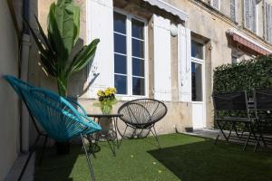 Appartements LaConciergerieJonzac, Maison Cote Vintage avec jardin : photos des chambres