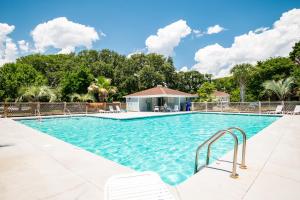 Beach Getaway Among The Oaks by Oak Island Accommodations