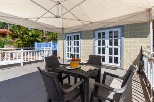 StayVistas Chimney Cottage with Sprawling Lawns, Picturesque Views, Plunge Pool, Jacuzzi, and Home Theatre