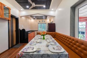 StayVistas Chimney Cottage with Sprawling Lawns, Picturesque Views, Plunge Pool, Jacuzzi, and Home Theatre