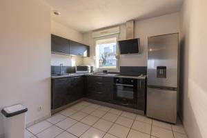 Appartements LaConciergerieJonzac, Appartement La Desirade : photos des chambres