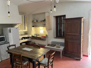 Appartements Logement atypique tout en pierre : photos des chambres