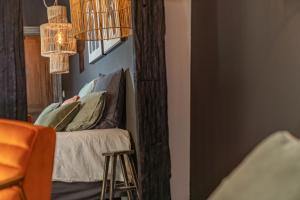 Appart'hotels La Maison de Lyna - Suites de charme intra-muros avec parking & autonomie : photos des chambres