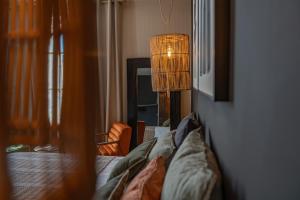 Appart'hotels La Maison de Lyna - Suites de charme intra-muros avec parking & autonomie : photos des chambres
