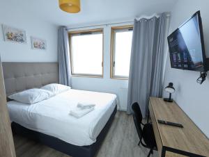 Appartements Beau-Jean, Un Cocon Sympa 5 min a Pied du Centre-Ville, Parking Prive, a 10 min du CHU : photos des chambres