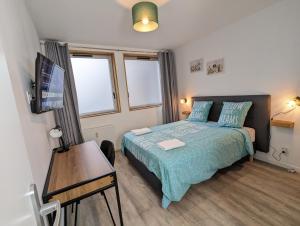 Appartements Beau-Jean, Un Cocon Sympa 5 min a Pied du Centre-Ville, Parking Prive, a 10 min du CHU : photos des chambres