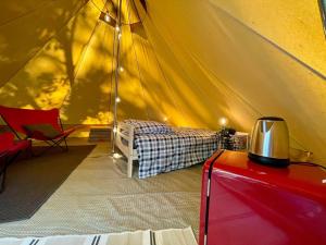 Tentes de luxe Tente Indiana Pins - La Teouleyre : photos des chambres