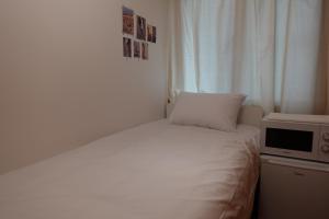 Phòng Đơn Với Phòng Tắm Vòi Sen Và Toilet Chung (Single Room with Shared Shower and Toilet)