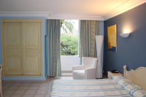 Hotels Hotel Les Palmiers : photos des chambres